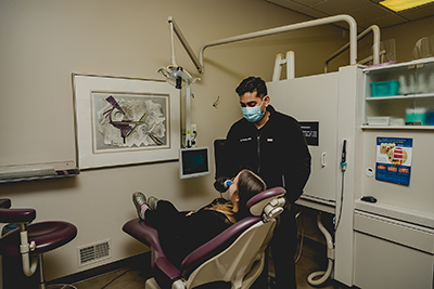 Dr. Haque with a patient at Dental Smiles of Livonia